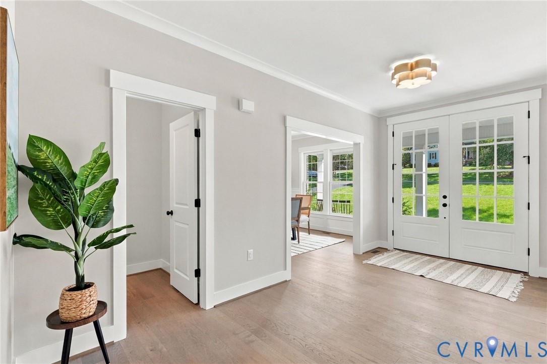 Foyer Double Entry Door Provides Plenty of Natural Light - Interior Door to Powder Room