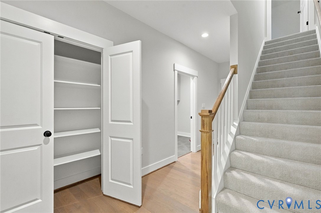 Photo Depicts the Kitchen Pantry & the Stairway to the 4th Bedroom/Rec Room/Bonus Room