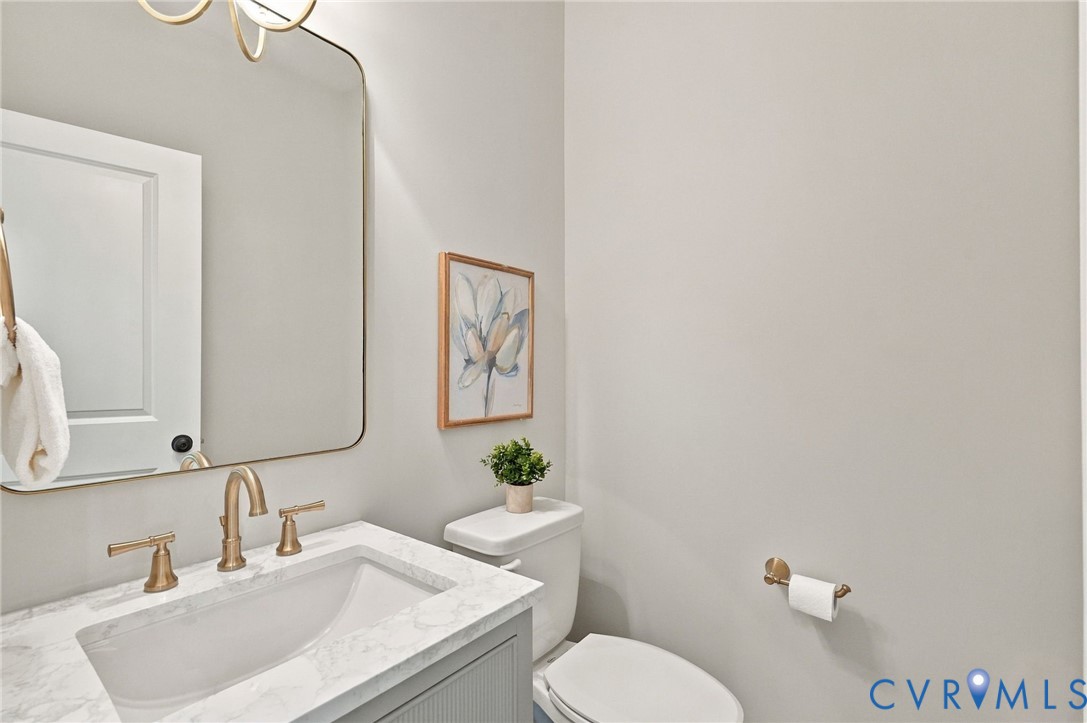 Powder Room has Upgraded Light Fixture, Vanity & Mirror to Greet You & Your Guests