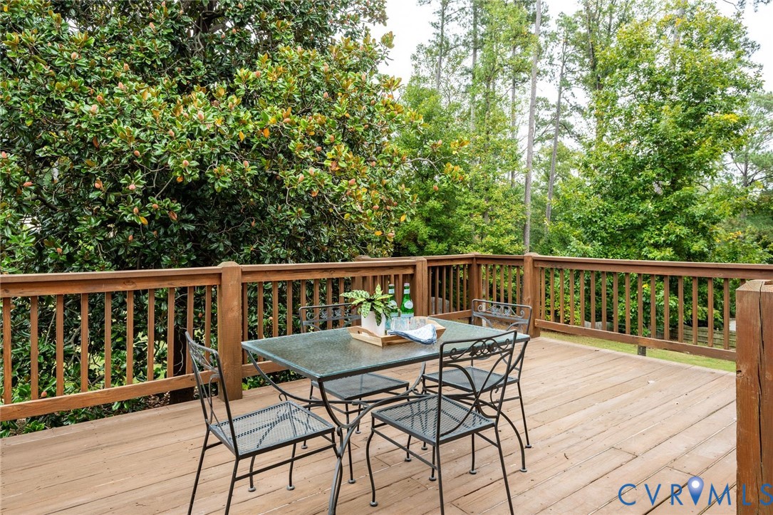 Directly off of the rec room, this is one of two large outdoor entertaining areas, capturing the sweeping lawn and privacy.