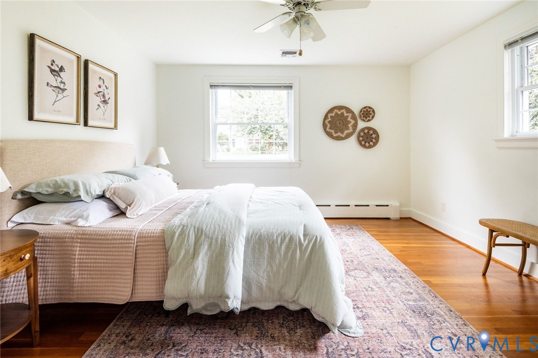 Second of five bedrooms with hardwood floors and dual exposure windows.