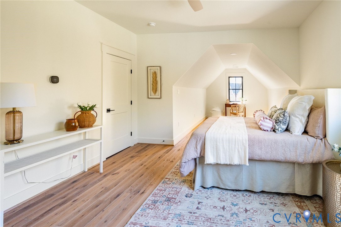 1 of 3 upstairs bedrooms, hardwood floors, sitting area, walk-in closet, jack-and-jill bathroom.