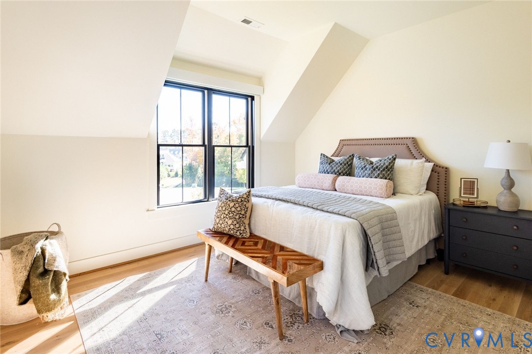 3 of 3 upstairs bedrooms, hardwood floors, private ensuite bathroom, walk-in closet.