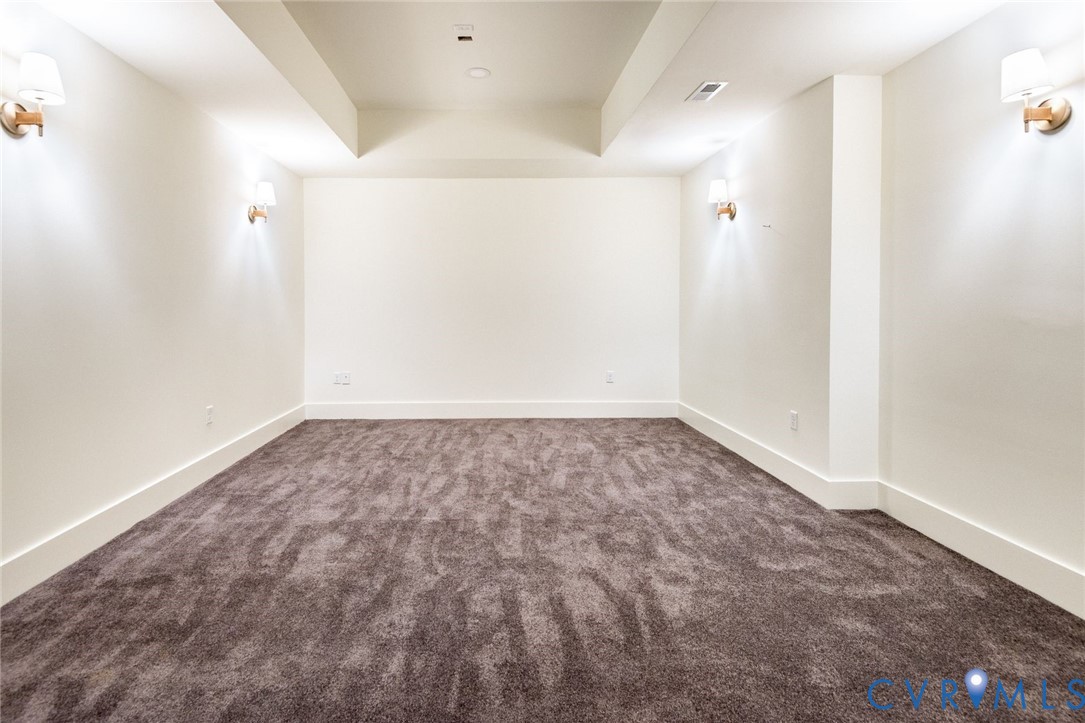 Double-insulated theatre with dual lighting and sound-muffling carpet.