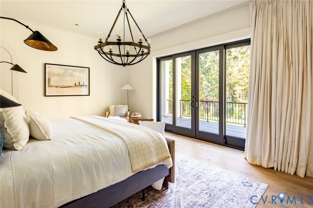 First floor primary wing with sliders to balcony, ensuite spa-inspired bath, private office and custom walk-in closet.