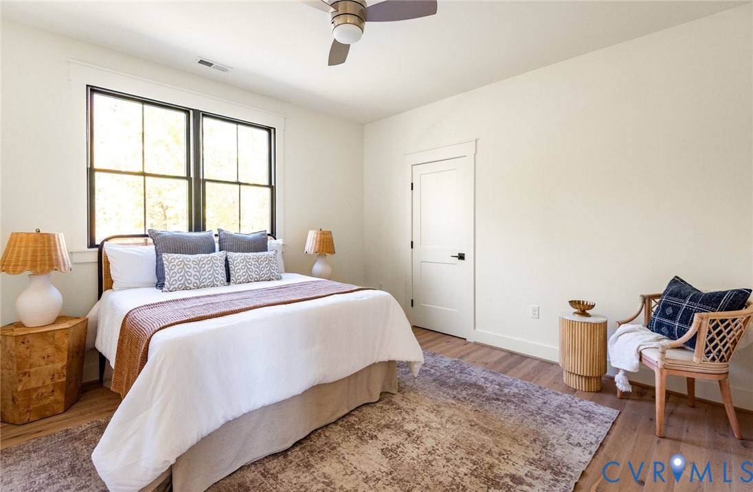 2 of 3 upstairs bedrooms, hardwood floors, walk-in closet, jack-and-jill bathroom.