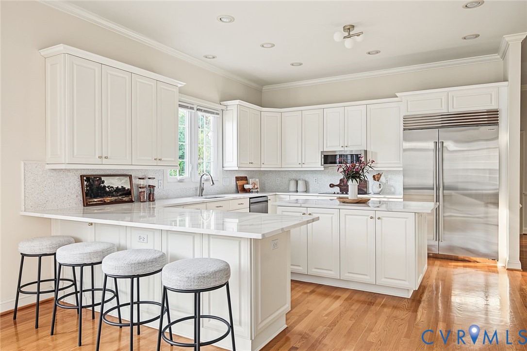 Top of the line stainless appliances including new Sub Zero fridge and double oven.
