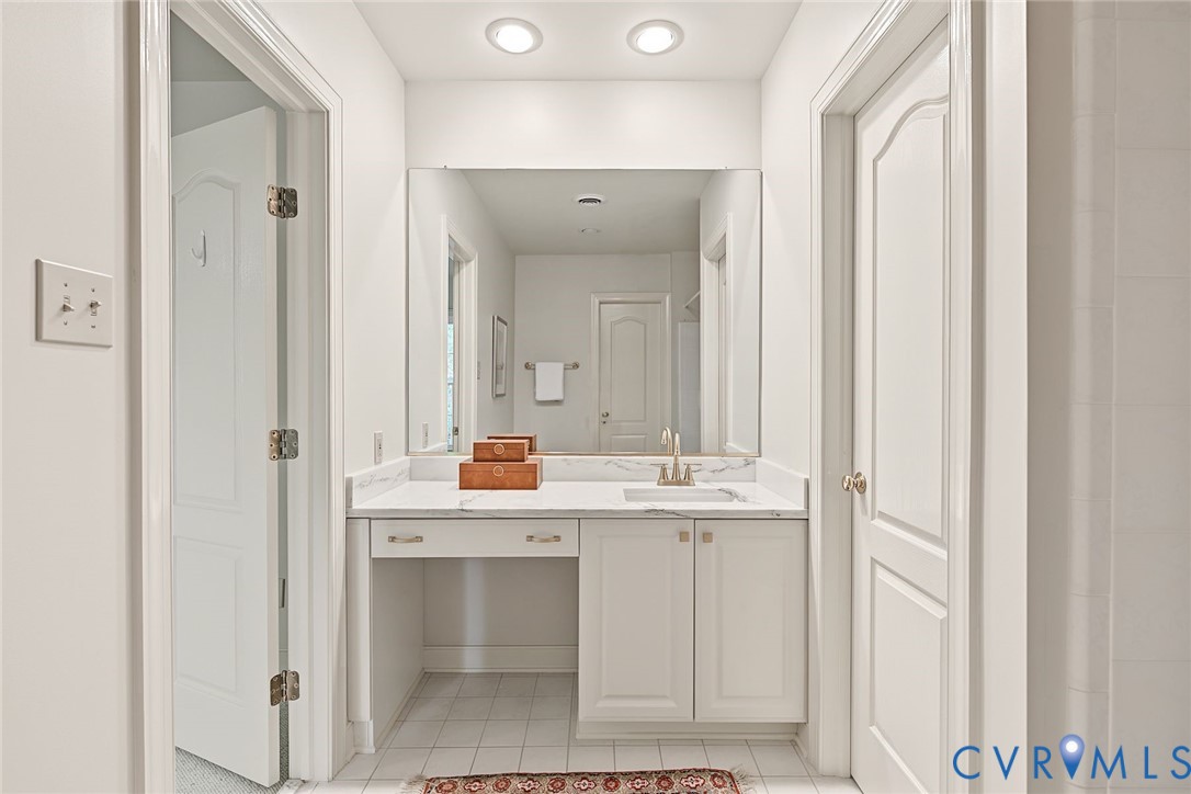 2nd Floor primary with new quartz counters, brass fixtures and a generous walk in closet.