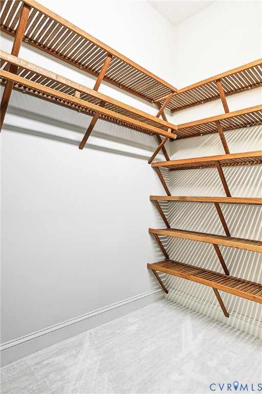 Each bedroom throughout the home features these gorgeous custom wood shelves.