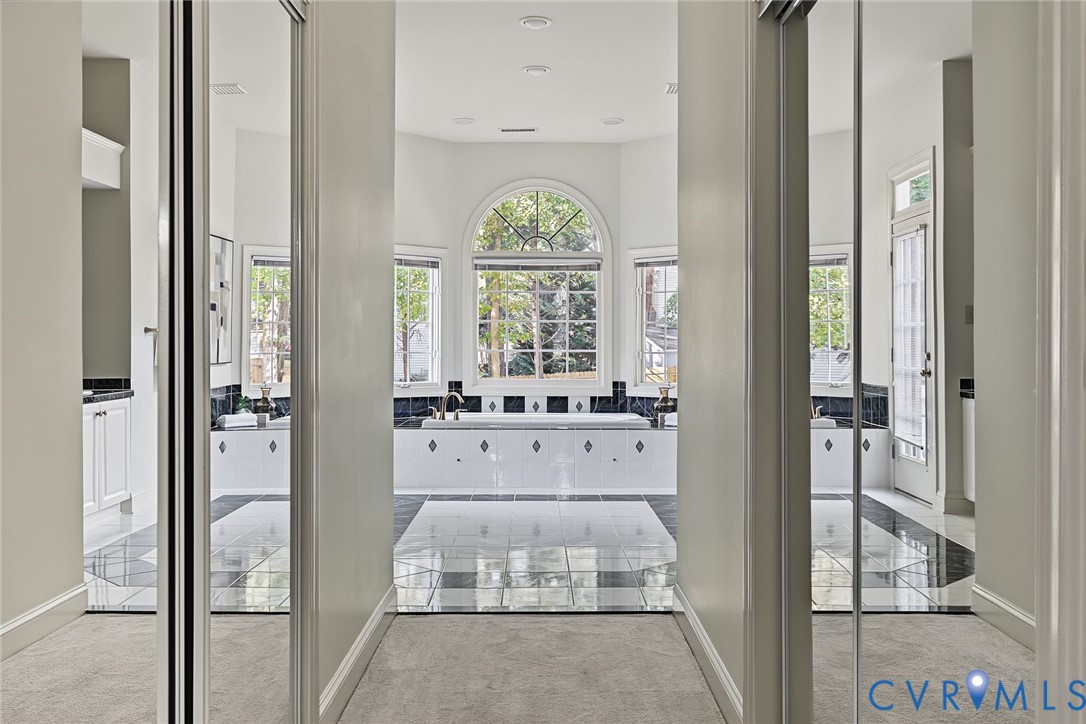 The primary suite features two walk in closets and spacious bathroom.