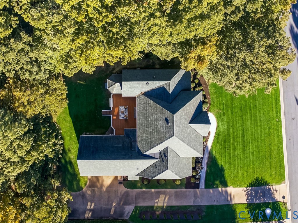 Picture perfect property with a blend of professional landscaping and established trees.