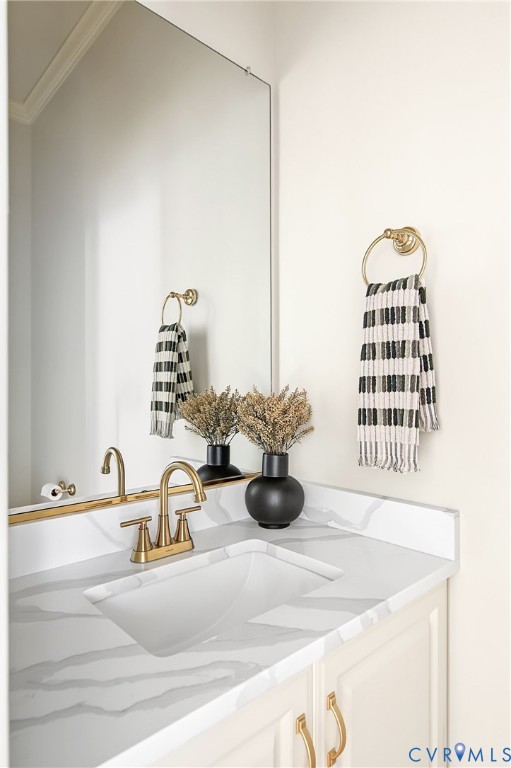 Renovated first floor powder room tucked discreetly across from the coat closet as you enter from the garage or side pedestrian door.