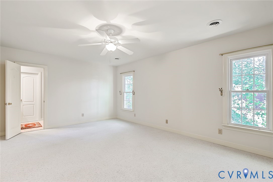 Bedroom 2/Second floor primary suite with walk in closet and en suite bathroom.