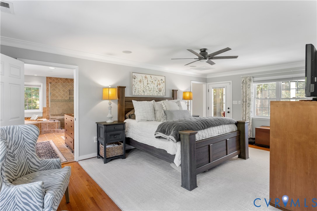 1st Floor primary Natural light from front to rear! Private access to the screened porch Wood flooring