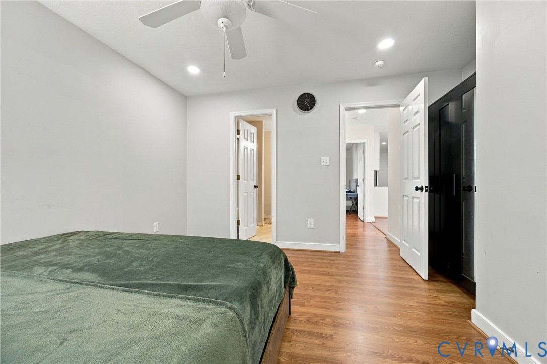 Bedroom featuring wood-finish flooring, recessed lighting, and a ceiling fan