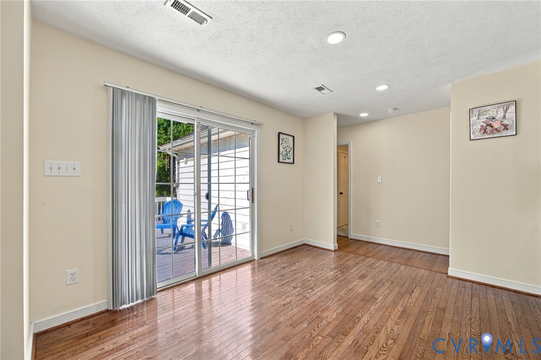 Breakfast area, Wood-finish flooring, sliding glass door, and recessed lighting