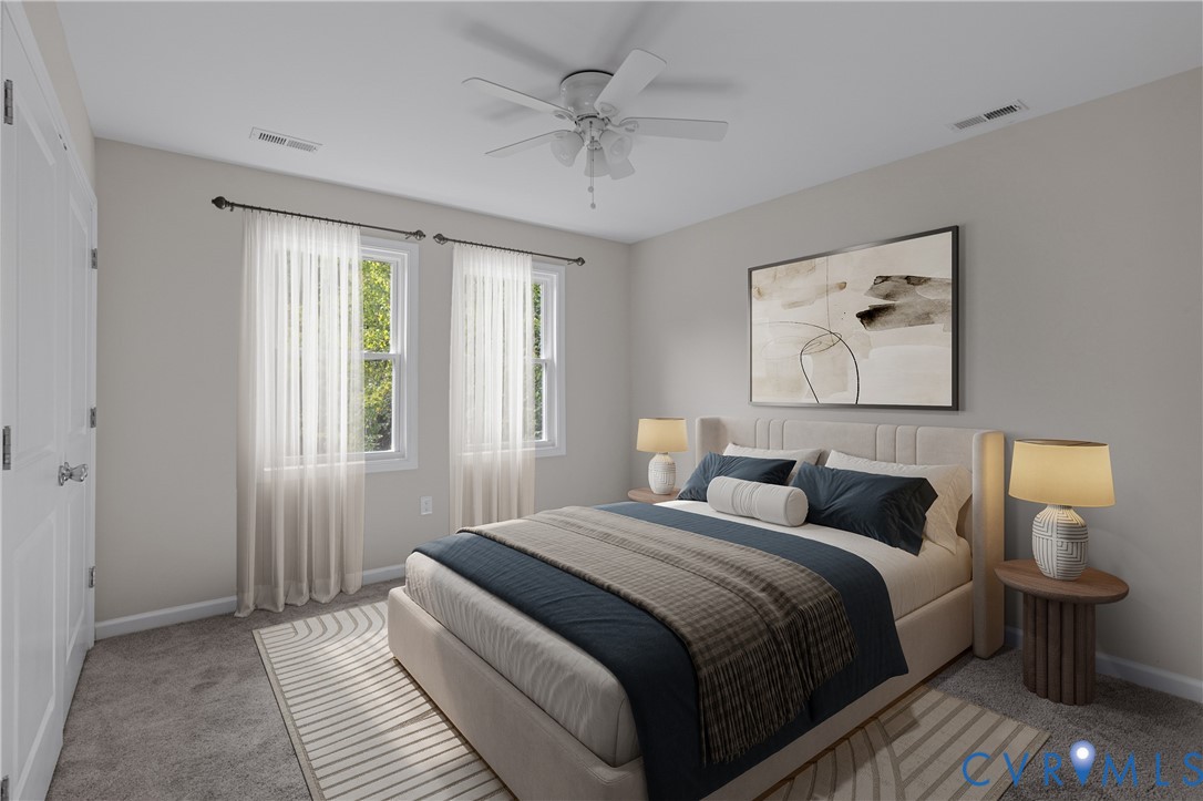 Neutral-toned interior featuring plush carpeting, dual-pane windows, and a ceiling fan with integrated lighting