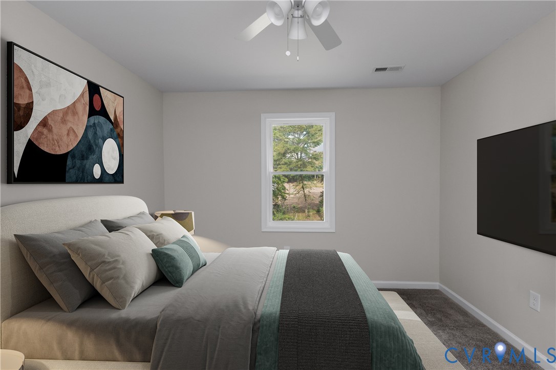 Bedroom featuring wall-to-wall carpeting, a single-hung window, and a ceiling-mounted light fixture with an integrated fan