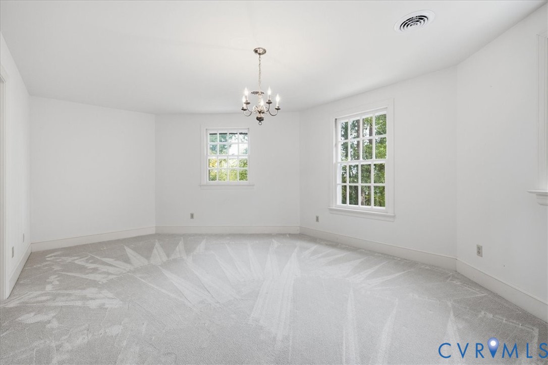 Ample wall space in the second upstairs bedroom
