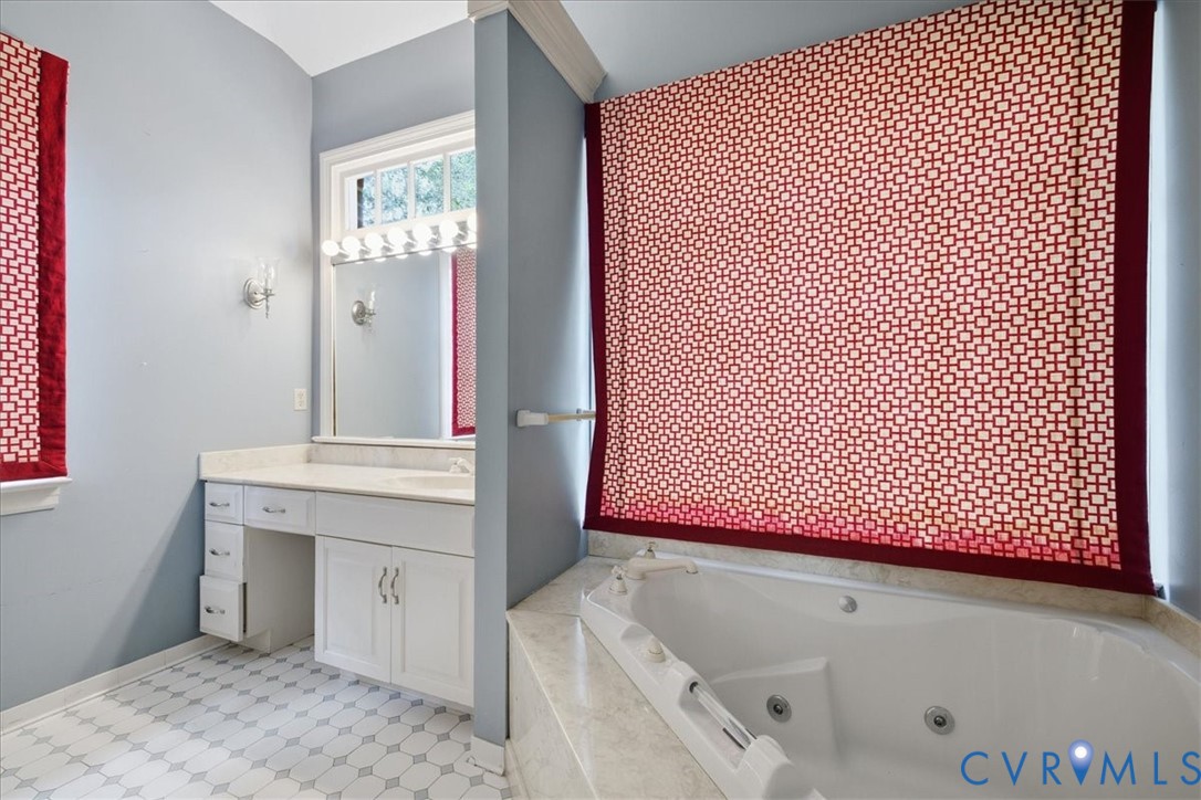 The Primary Bath has a jetted tub and separate shower.  Lots of light.