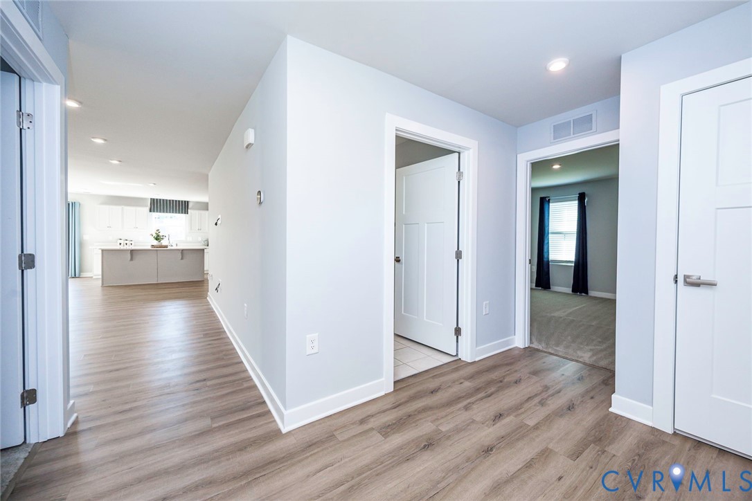 Foyer Looking into Bedroom and into Family Room & Kitchen Foyer Looking into Bedroom and into Family Room & Kitchen