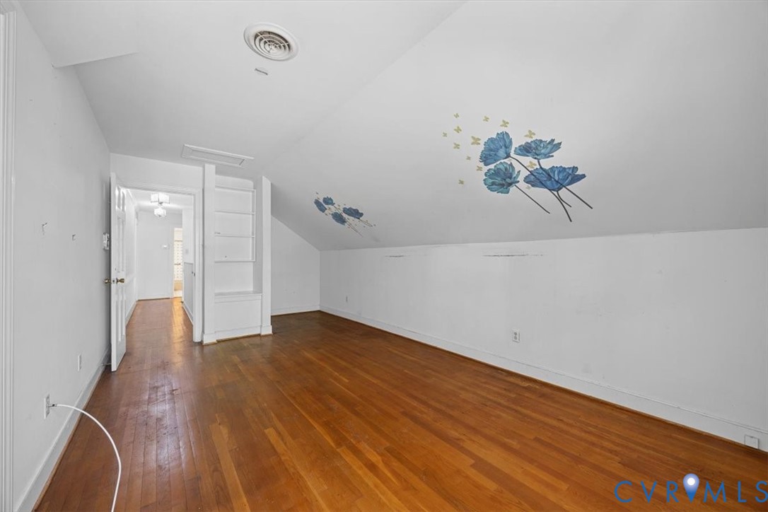 Upstairs Bed #3 with dormered ceiling and built in shelves