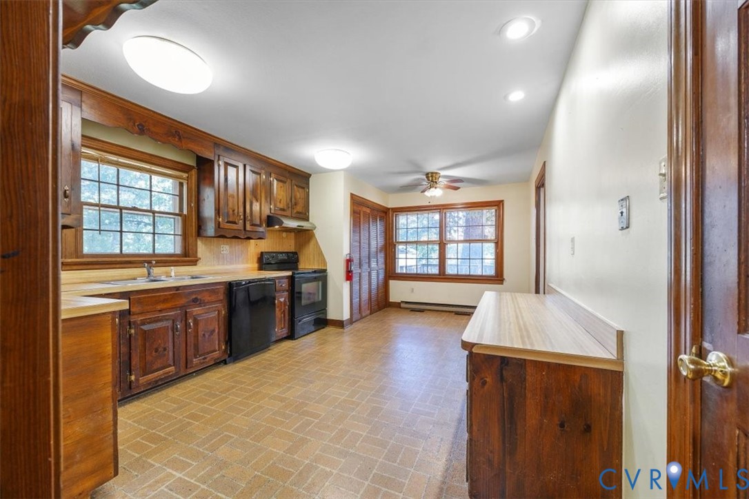 Eat-in kitchen with built in desk and laundry closet