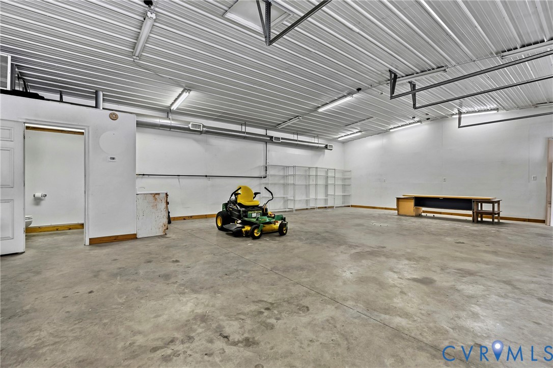 30'x40', 1,200 sqft detached workshop. lift-ready, AC, heated floors, bathroom