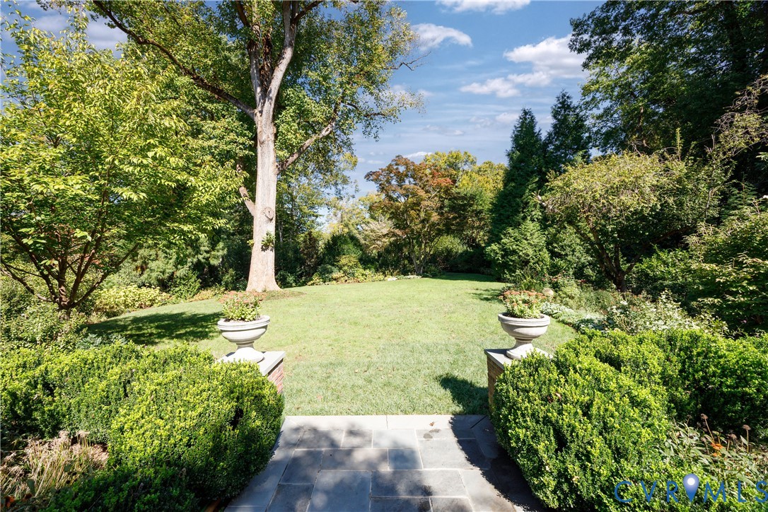 Bluestone paths link the terraces to the lawn.