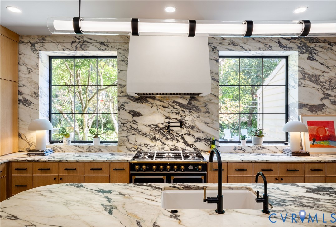 La Cornue range beneath a custom plaster hood.