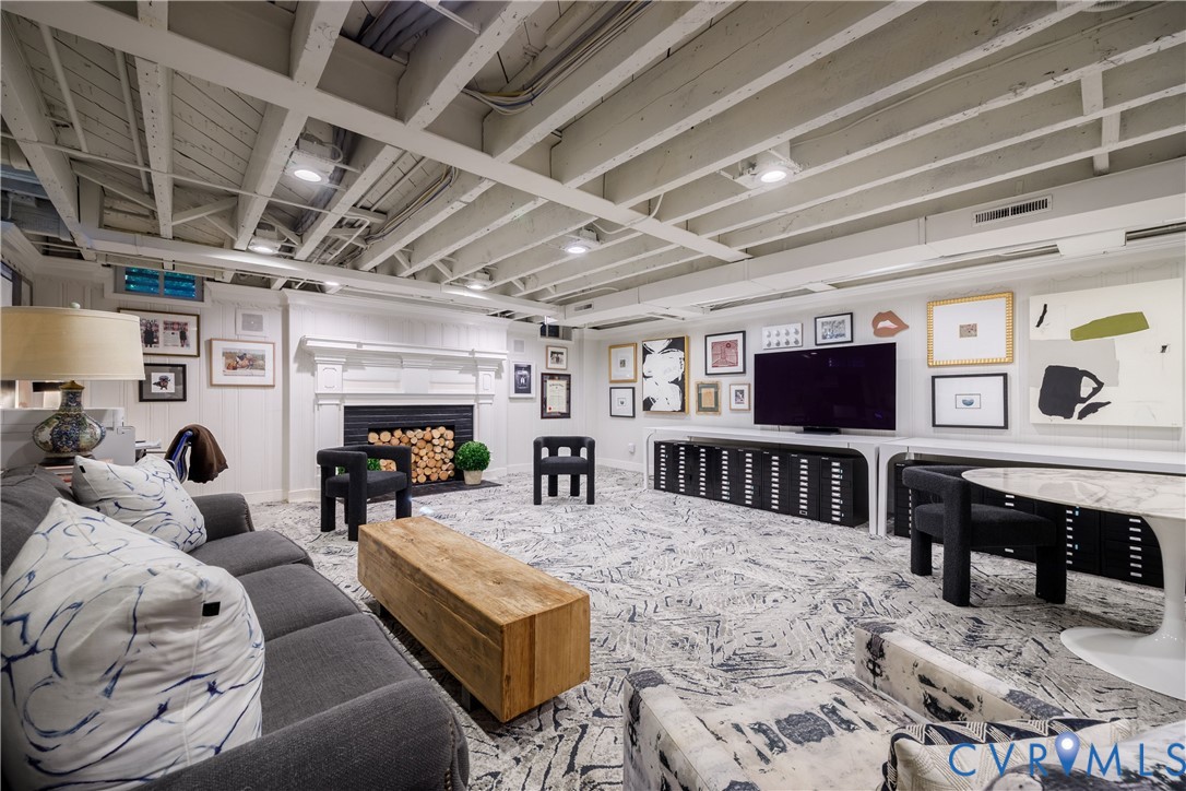 Recreation room with fireplace on the walk-out lower level.