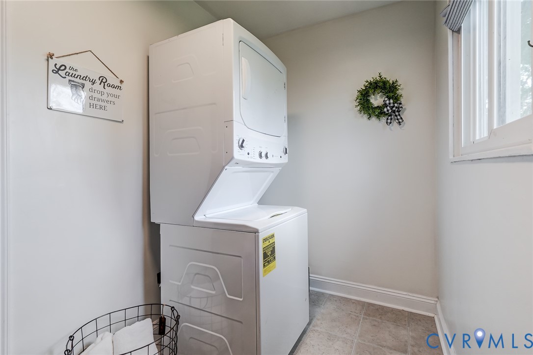Stacked laundry unit, new flooring and darkening shade