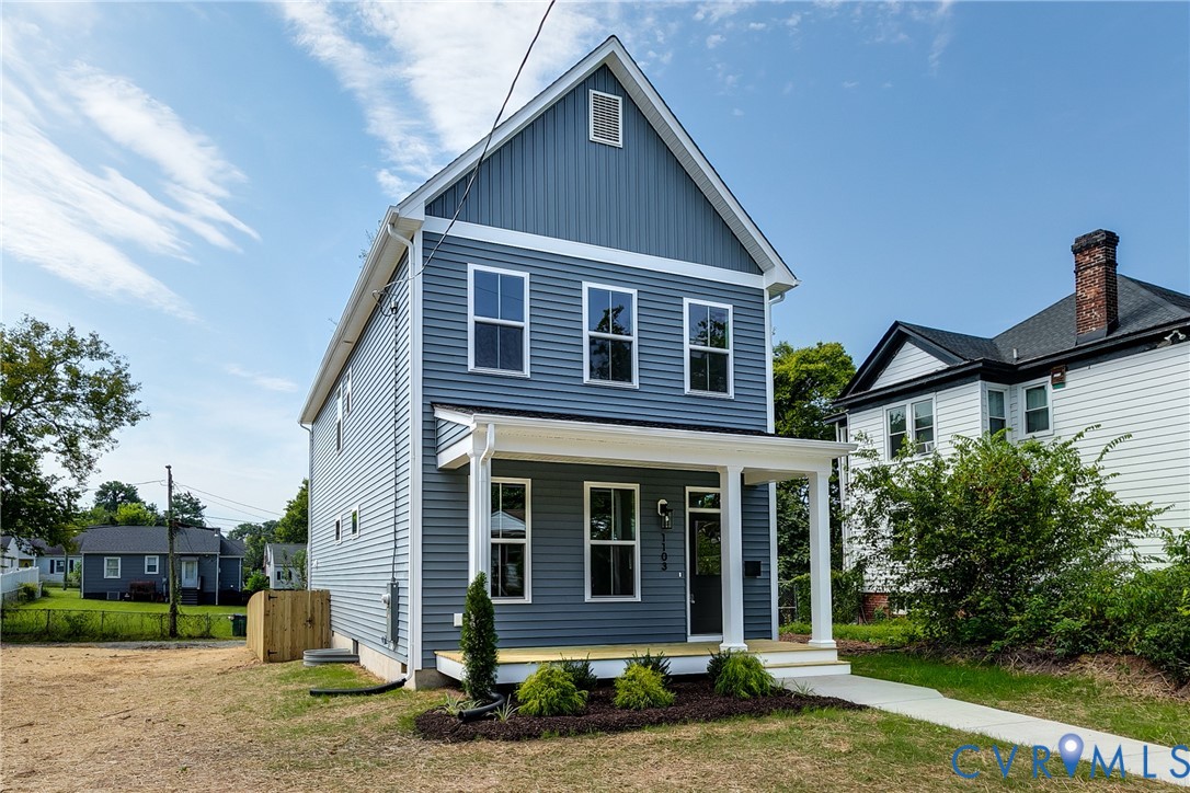 Two-story exterior featuring blue horizontal siding, white trim, a covered front porch with square columns, and a gable roofline Two-story exterior featuring blue horizontal siding, white trim, a covered front porch with square columns, and a gable roofline