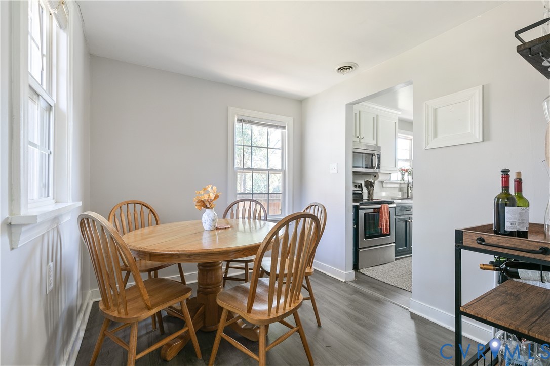 Multi-pane windows, wood-finish flooring, and neutral wall tones