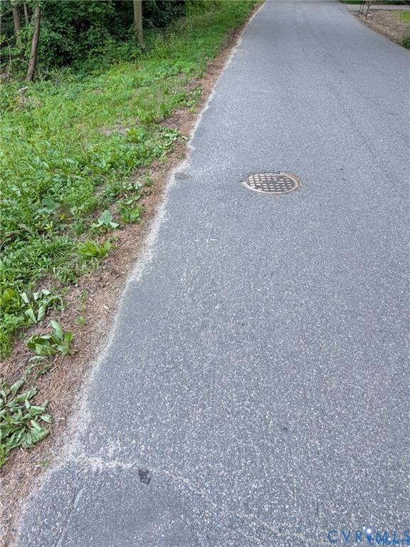 Street view - sewer at the street. Street view - sewer at the street.