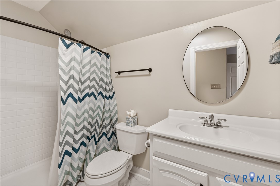 Third floor full bath. New fixtures, toilet, mirror and quartz countertop.