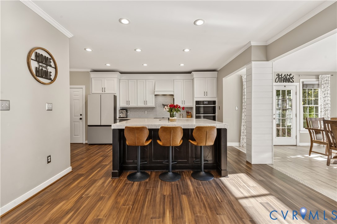 Completely remodeled kitchen and opened up to Morning Room. Govee lighting and quartz countertops.