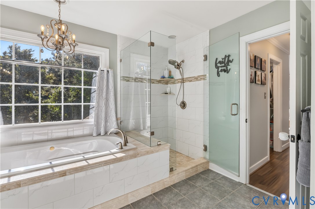 Jetted rub and walk-in shower in the owners bath.