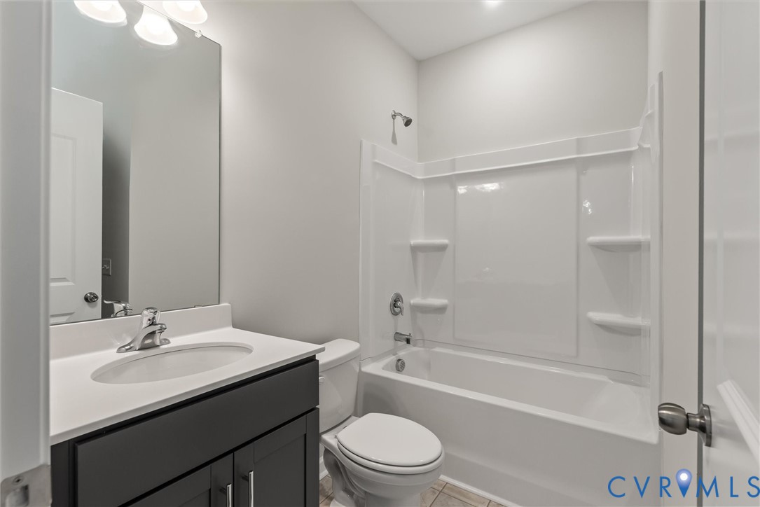 First Floor Guest Suite bath. This home is TO BE BUILT. The photo represents the plan, not the actual home. Design selections may vary.