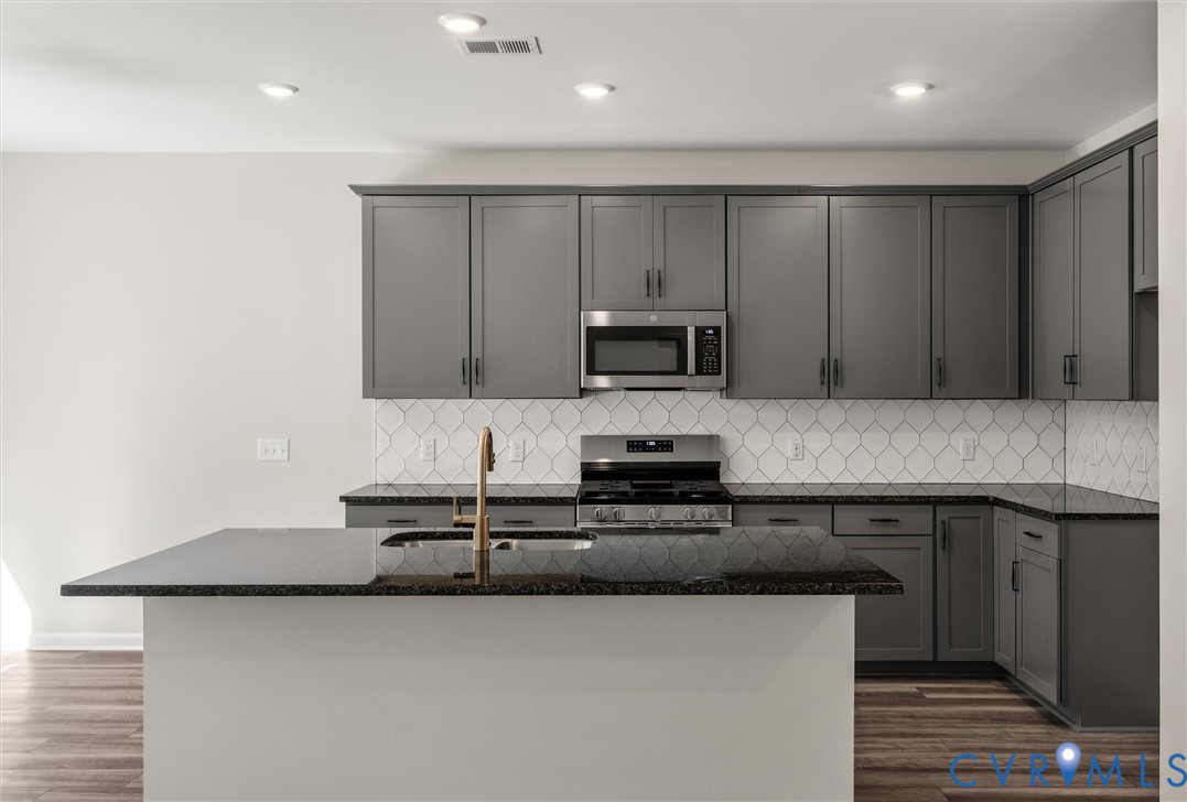This home is TO BE BUILT. The photo represents the plan, not the actual home. Design selections may vary. This home is TO BE BUILT. The photo represents the plan, not the actual home. Design selections may vary.