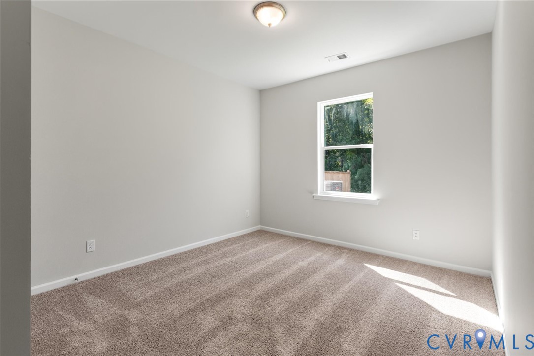 First Floor Guest Suite. This home is TO BE BUILT. The photo represents the plan, not the actual home. Design selections may vary.