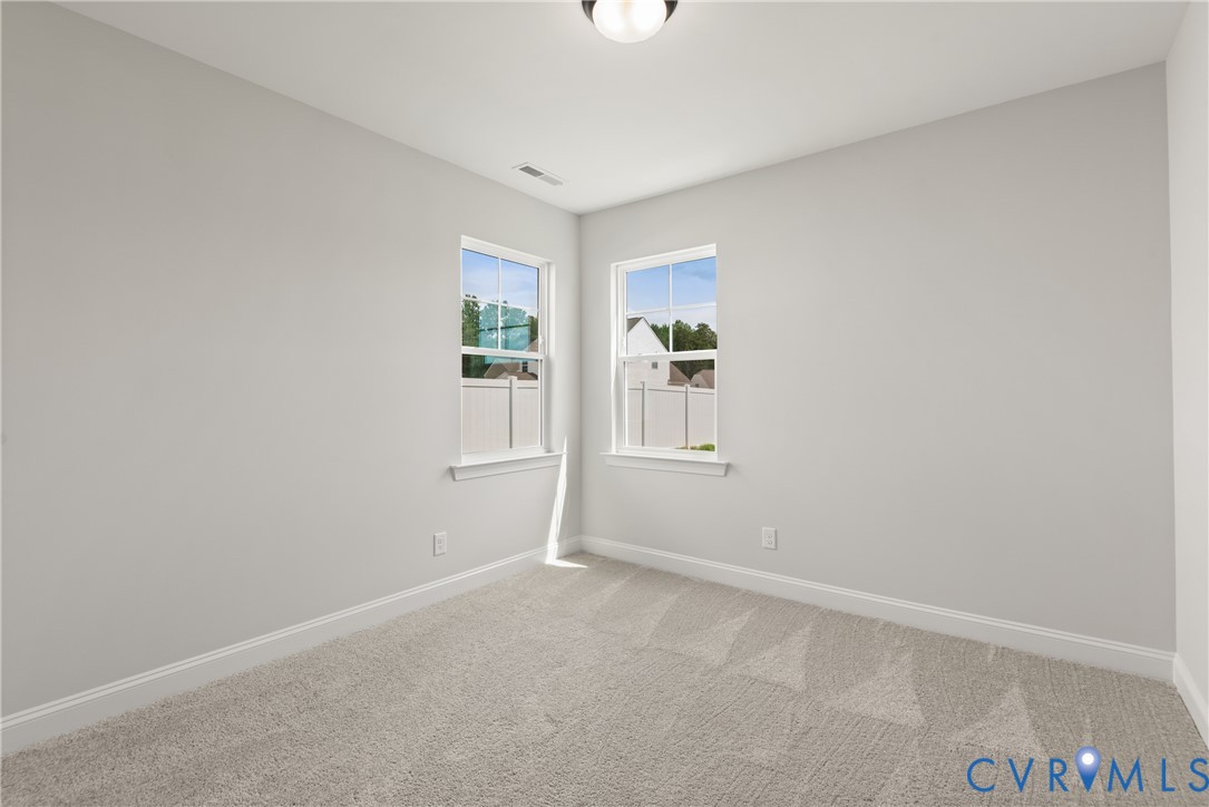 First Floor Guest Suite. This home is TO BE BUILT. The photo represents the plan, not the actual home. Design selections may vary.