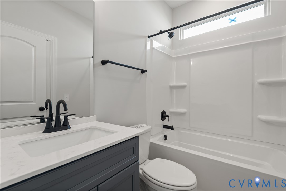 First Floor Guest Suite Bath. This home is TO BE BUILT. The photo represents the plan, not the actual home. Design selections may vary.