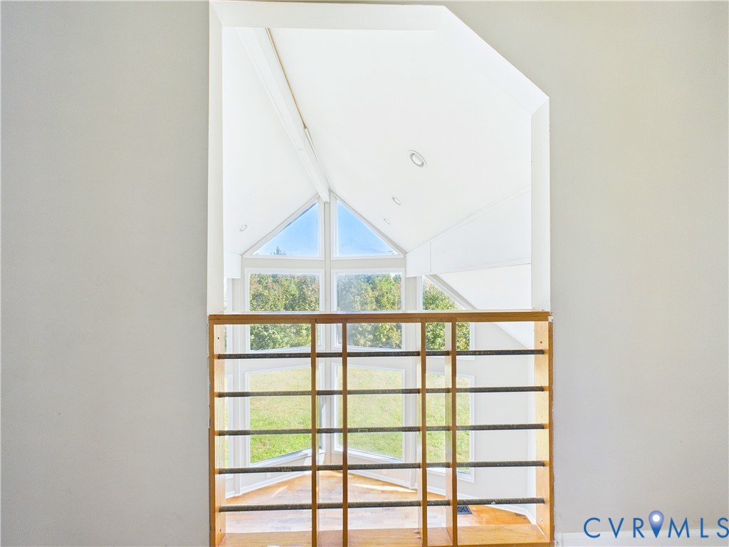 Upper level catwalk showcasing family room below