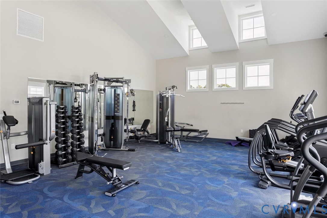 Premium community amenities featuring a fully equipped, modern fitness center just steps away.
