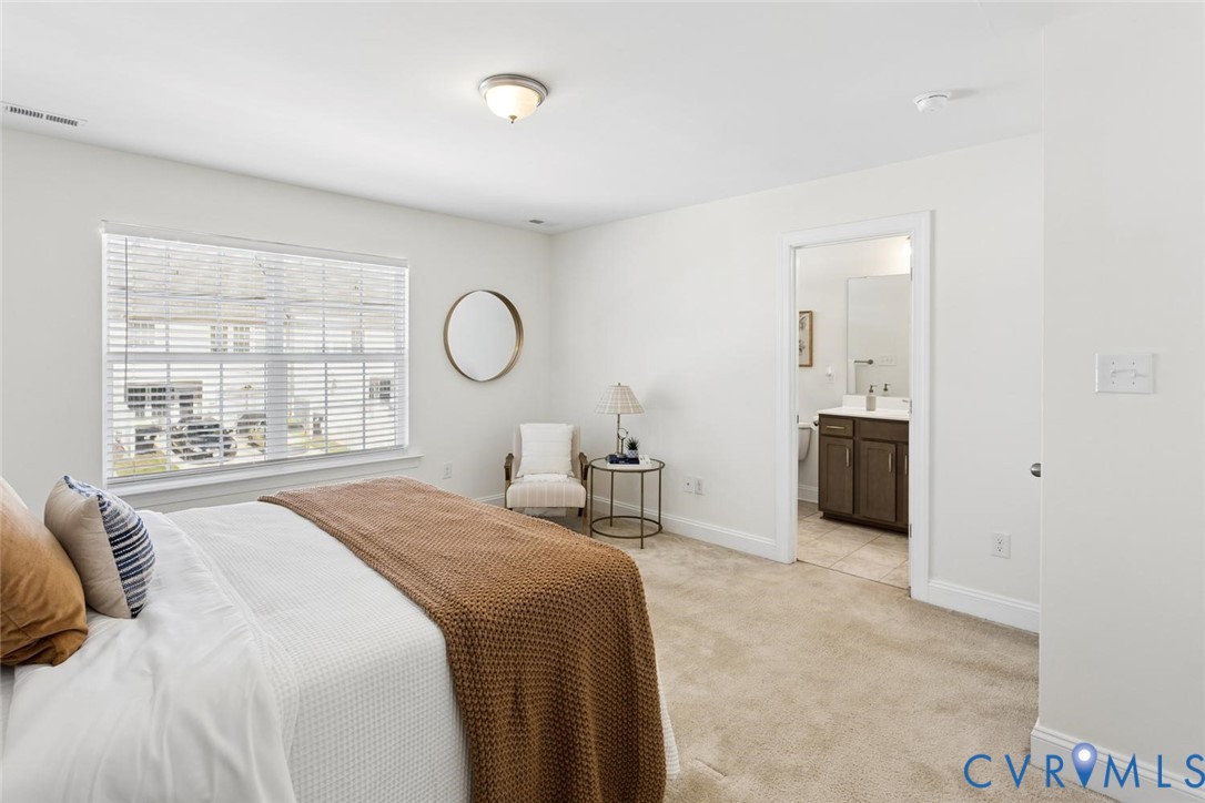 Carpeted flooring, a window with blinds, and a flush-mount ceiling light.