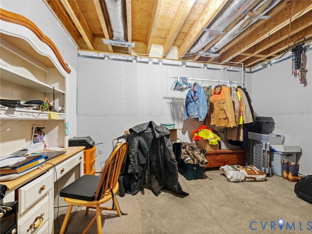 This partially finished room in the heated and cooled basement offers endless possibilities! An ideal space for a home gym, theater room, craft room, home office, or hobby space, ready to customize to suit your needs!