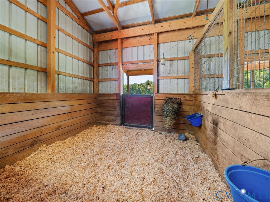Spacious horse stalls feature attractive wood-paneled walls, sturdy construction, and natural light, providing a comfortable setting for your horses. Thoughtfully designed for both functionality and everyday care!