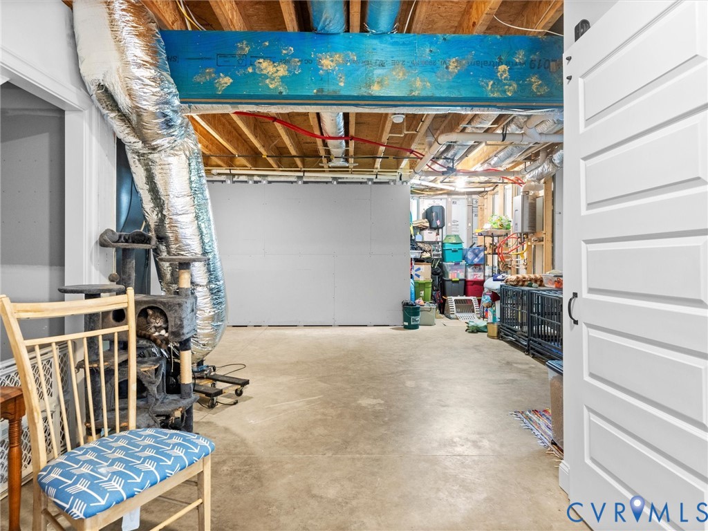 The spacious, heated and cooled walk-out basement offers plenty of flexibility for storage, hobbies, or additional living space. A charming sliding barn door leads to the fully finished basement bathroom, adding character and convenience!