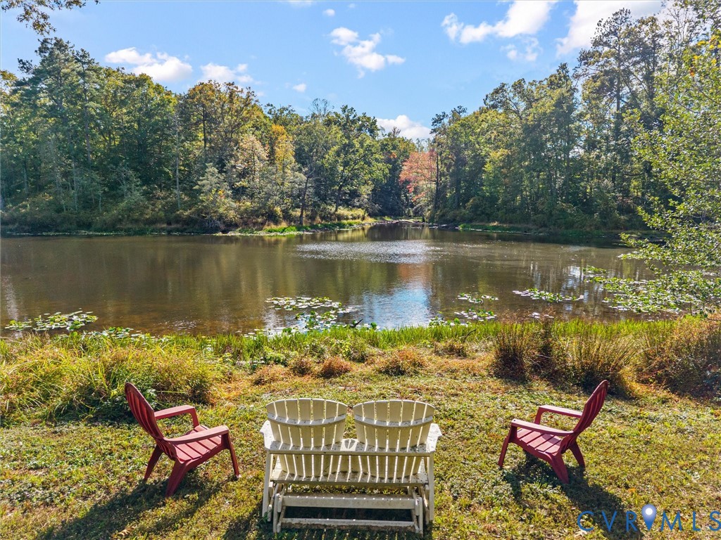 Imagine relaxing beside your own picturesque 2.5 +/- acre stocked pond! Surrounded by mature trees and beautiful natural scenery, this peaceful waterfront setting offers the perfect place to enjoy morning coffee, watch the wildlife, cast a fishing line, or simply unwind and take in the beauty of country living.